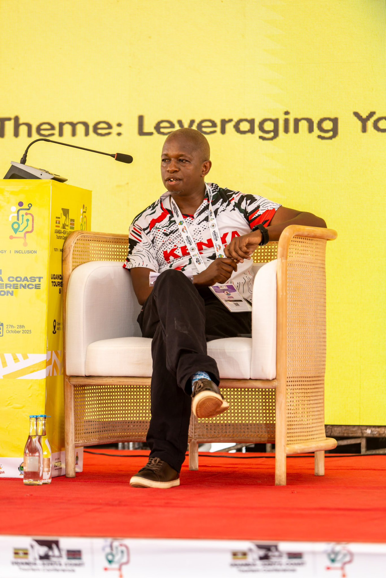 Paul Mutua addressing delegates under the conference theme "Leveraging Youth, Innovation & Inclusion"