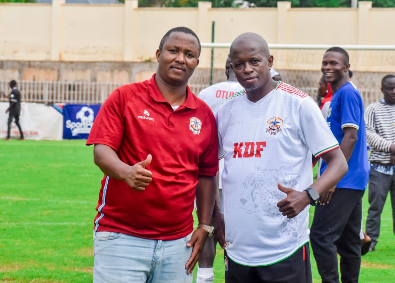 Officials and coaches pitchside