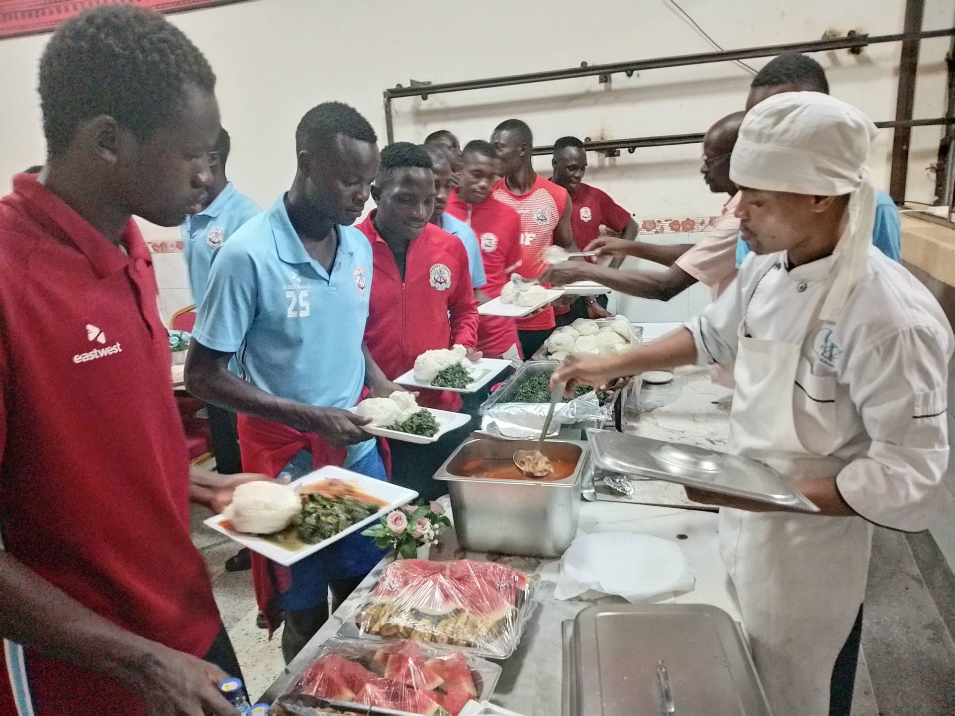 Players being served a team meal